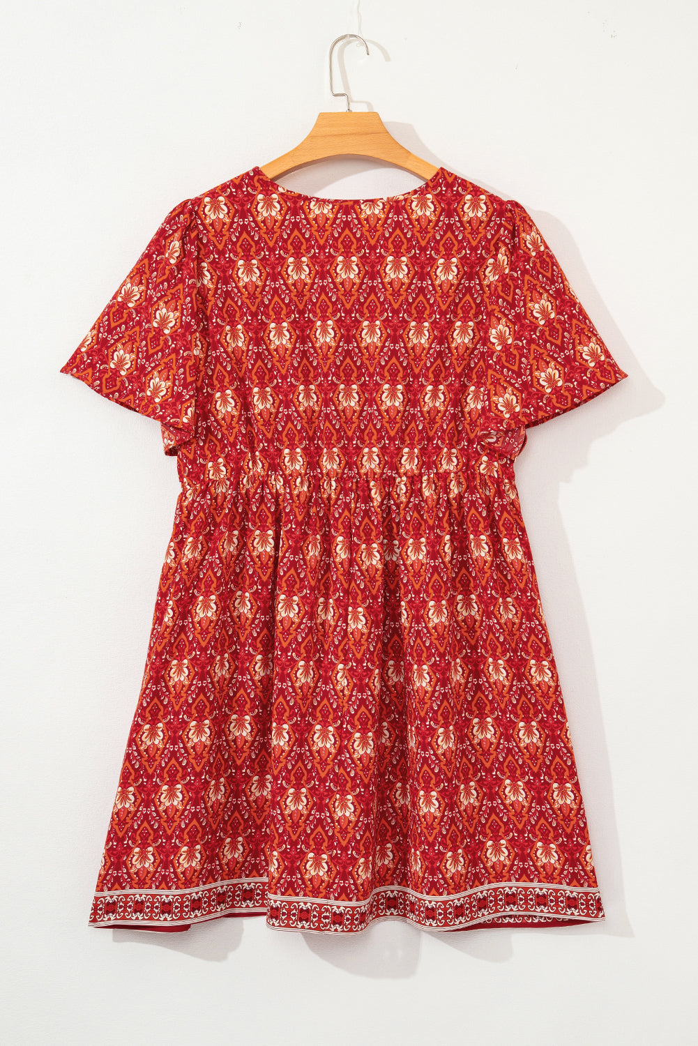 Somewhere Between Surplice Neck Empire Waist Flowy Mini Dress