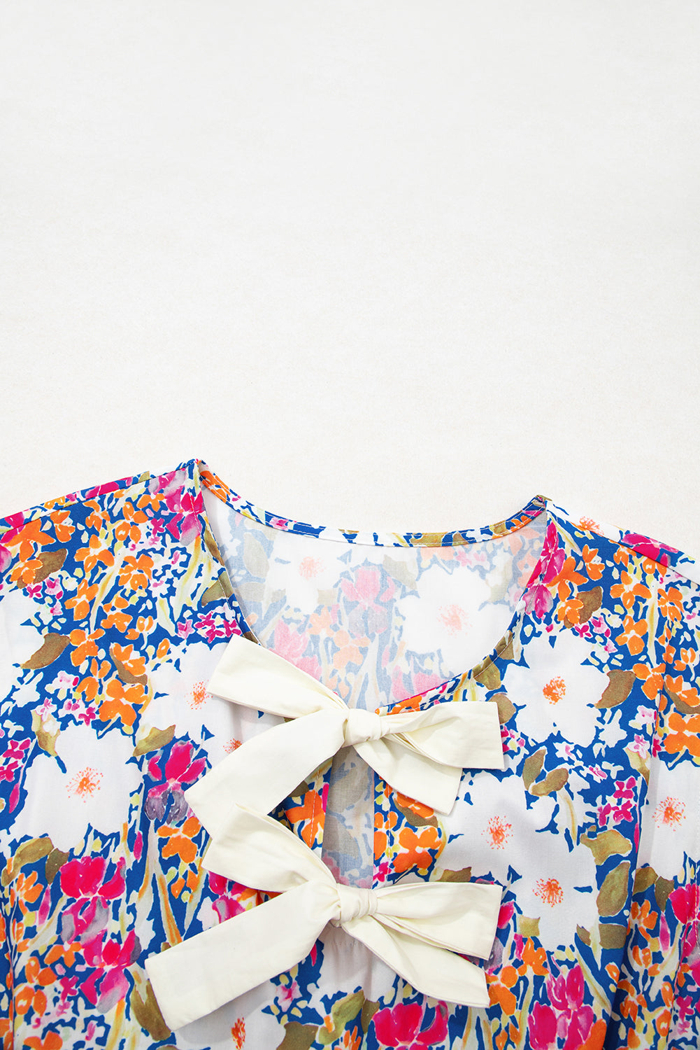 Floral Print Bow Applique Slit Sleeveless Peplum Blouse